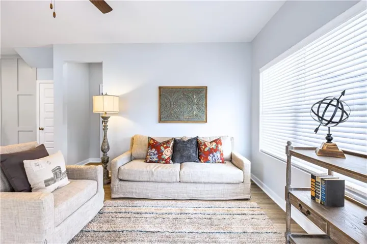 This bright living space offers comfort and style with natural light and refined finishes.