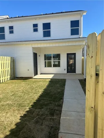 This modern home offers a lovely private yard, perfect for outdoor enjoyment and serene relaxation.