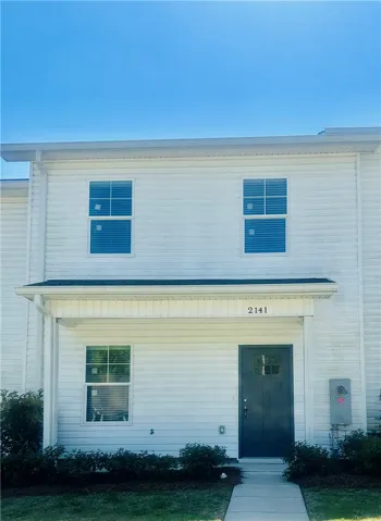 This two-story residence features clean lines and a welcoming entryway.