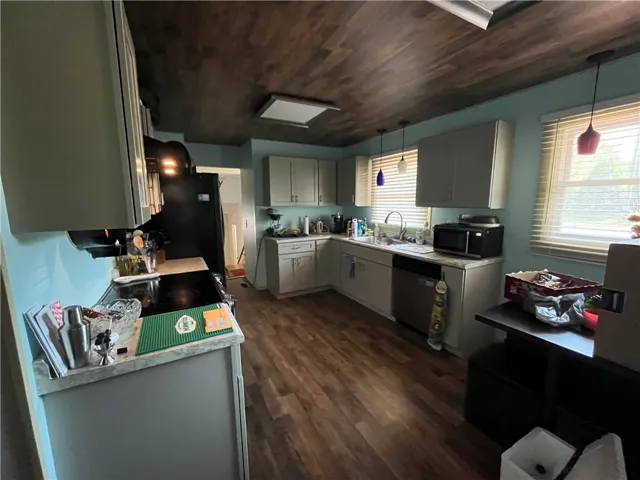 This spacious kitchen offers ample cabinetry and modern appliances, perfect for everyday living.