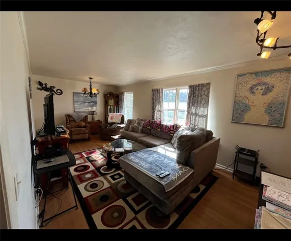 This inviting living area features hardwood flooring and abundant natural light.