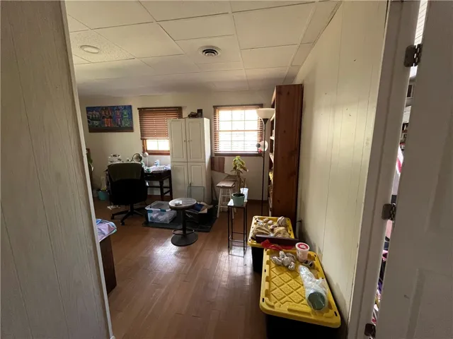 This flexible space features ample natural light and durable flooring, perfect for a home office or creative studio.