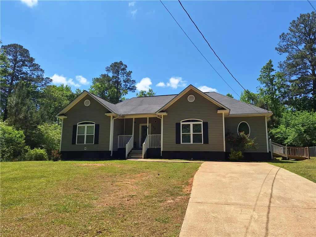 This charming residence features a well-maintained exterior and inviting front entrance.