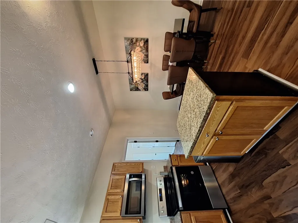 This spacious kitchen offers ample countertop space and a functional layout for daily living.