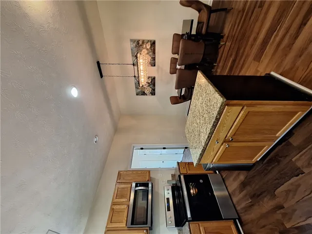 This spacious kitchen offers ample countertop space and a functional layout for daily living.