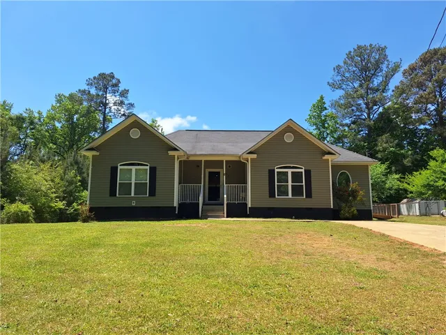This charming home offers a welcoming facade with a classic design.