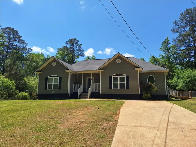 This charming residence features a well-maintained exterior and inviting front entrance.