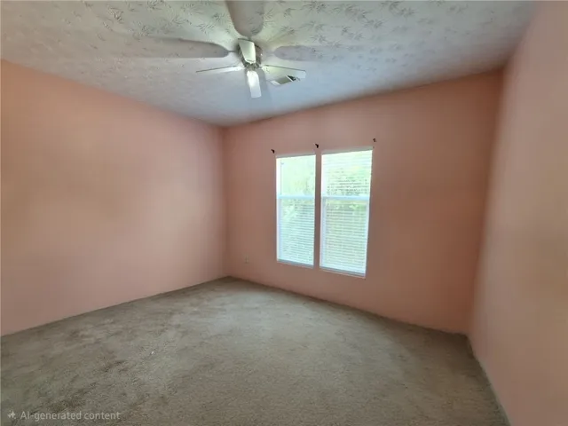 This airy bedroom offers comfort and natural light through expansive windows.