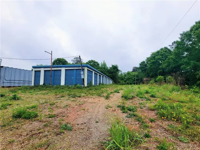 This property features storage units with convenient access and ample outdoor space.