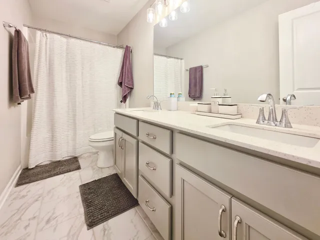 2nd Floor Hall Bath with quartz countertop dual vanity & tub/shower