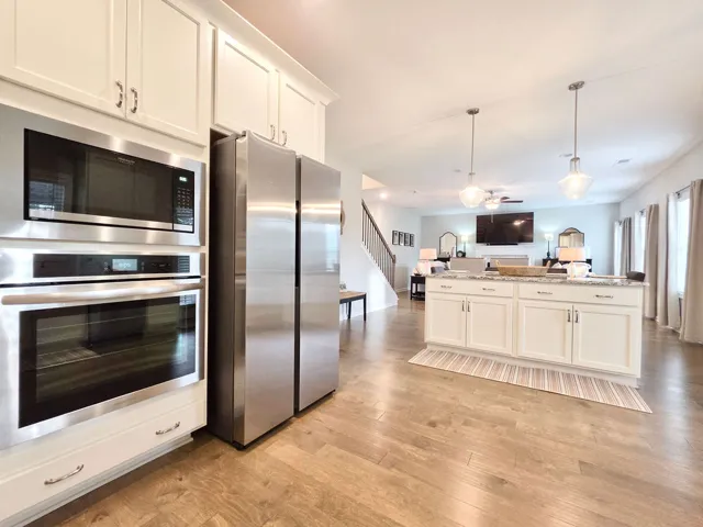 This spacious kitchen with an island is perfect for culinary adventures and entertaining guests.