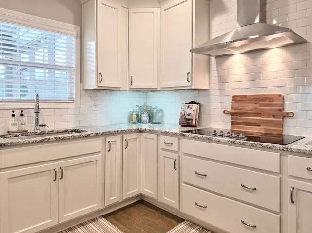 This bright kitchen features ample counter space and sleek appliances for everyday convenience.