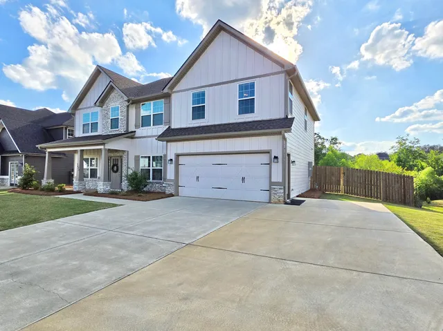 Side owner's entry to an extra wide driveway.