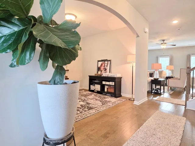 This inviting interior features elegant archways and warm hardwood flooring, creating a seamless flow.