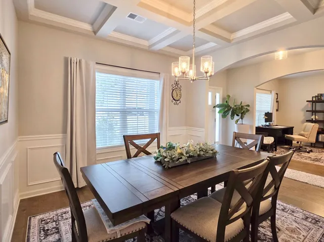 This dining area features elegant architectural details creating an inviting atmosphere for meals and gatherings.
