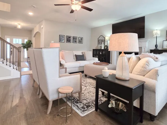 Great Room boasts rich wood floors and an elegant gas log fireplace.