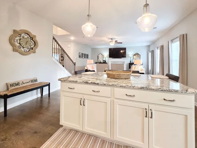 The island provides ample storage and overlooks the Great Room.