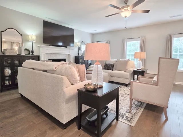 Great Room features hardwood flooring and a ceiling fan for optimal comfort.