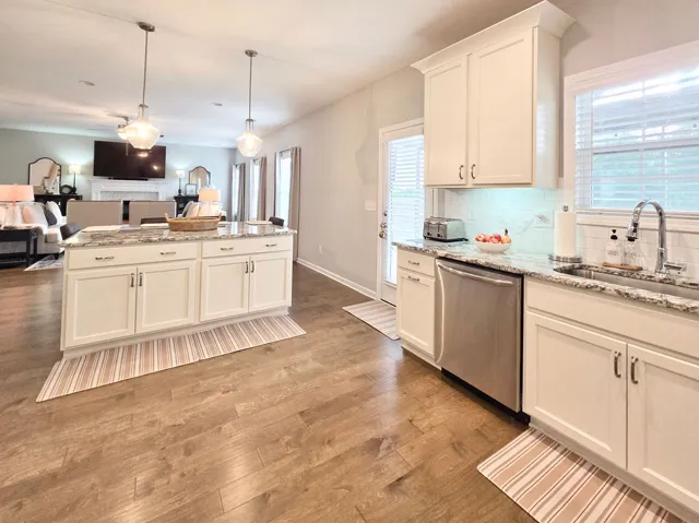 An inviting open-concept living space with a gourmet kitchen and ample natural light.