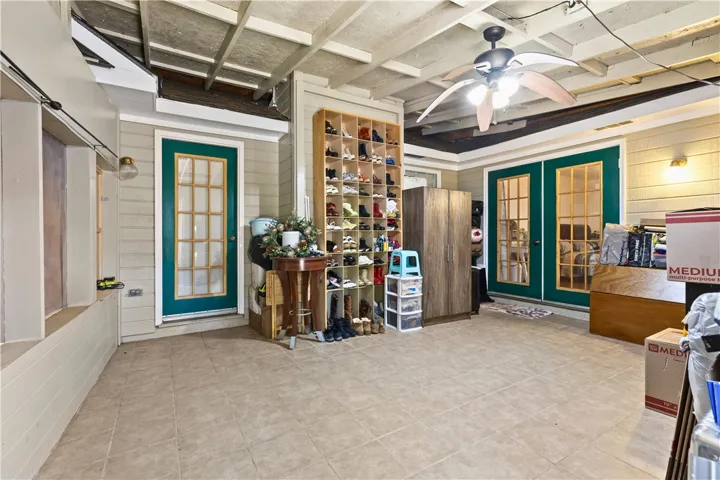 This enclosed porch at the back of the house offers additional space, ideal for storage or multi-purpose use.