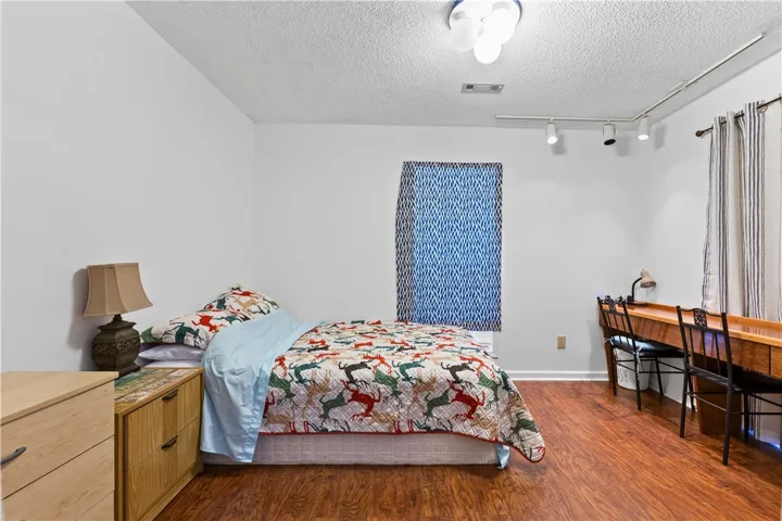 This cozy flex room offers rich wood flooring and abundant natural light.