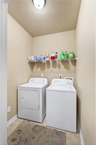This dedicated utility space offers convenient laundry amenities for everyday living.