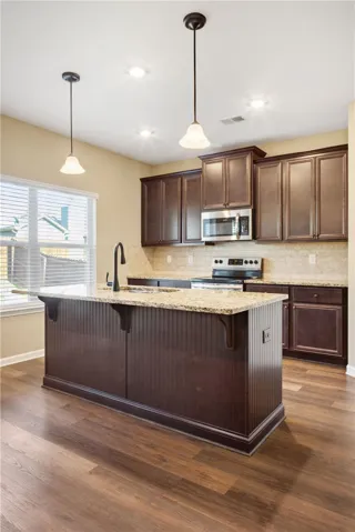 An inviting kitchen with a central island offers both style and practicality.