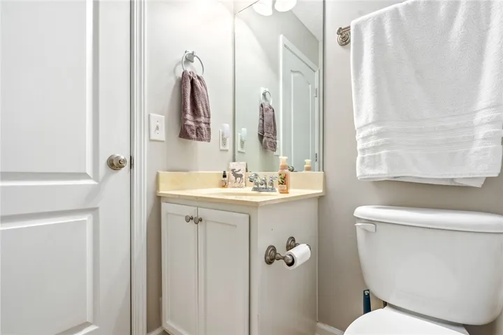This bathroom features a sleek vanity and convenient toilet for everyday comfort.