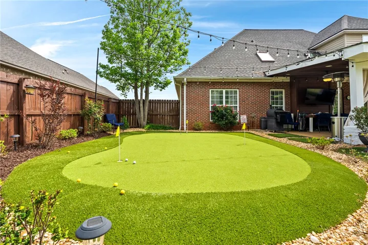 This outdoor space offers a private putting green, perfect for leisure and entertaining.