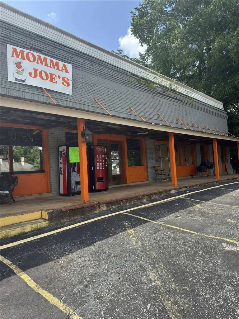 This commercial building offers a spacious storefront with ample parking.