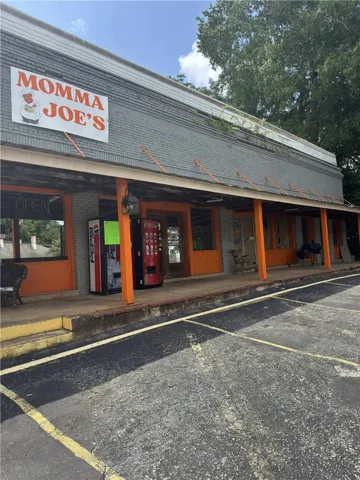 This commercial building offers a spacious storefront with ample parking.