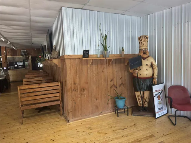 This welcoming entry area features hardwood floors and unique wall paneling.