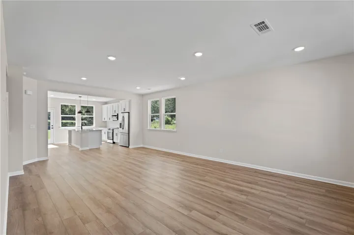 An inviting open-concept layout connects a well-appointed kitchen with a spacious living area.