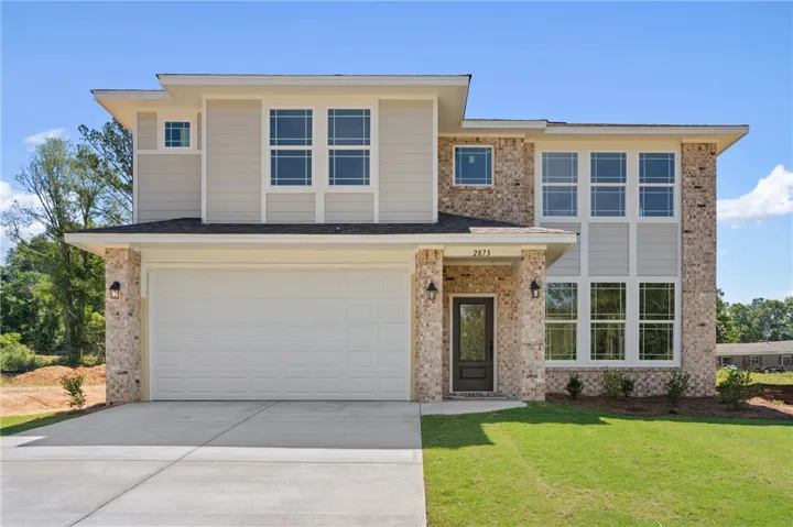 A newly built residence with a welcoming entrance and ample natural light.