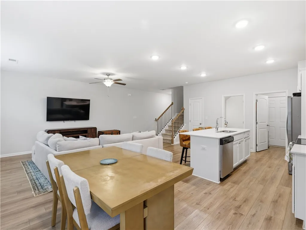 This inviting space combines living, dining, and kitchen areas for seamless daily life and entertaining.