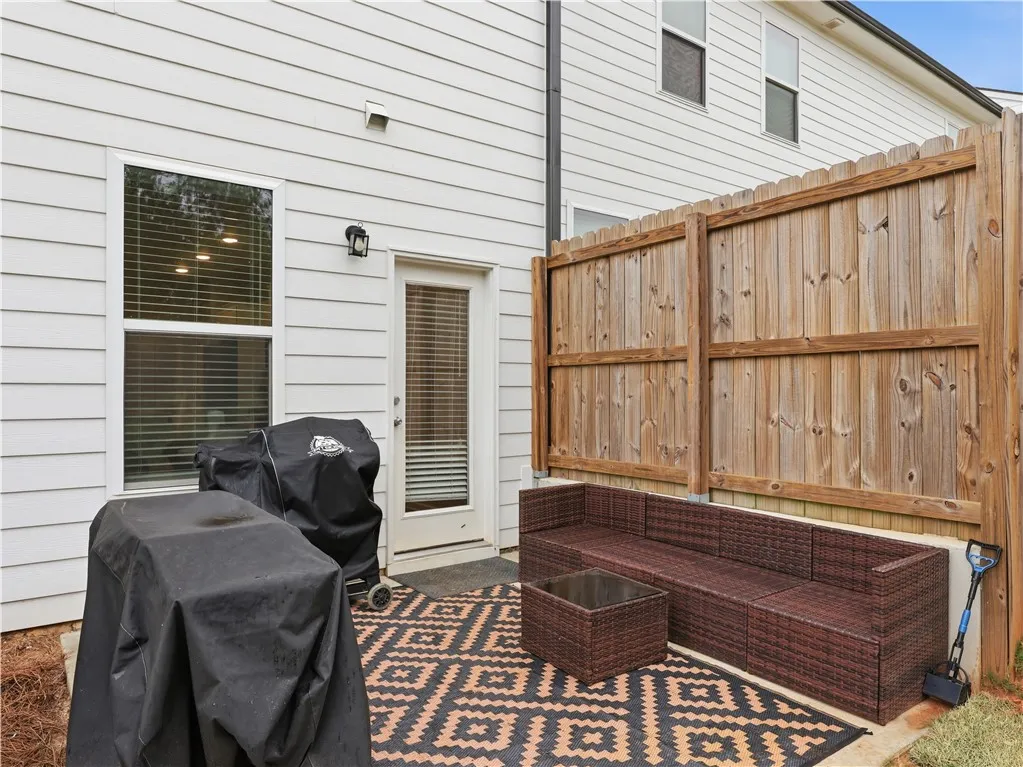 This cozy patio provides an inviting outdoor space for relaxation and entertaining.