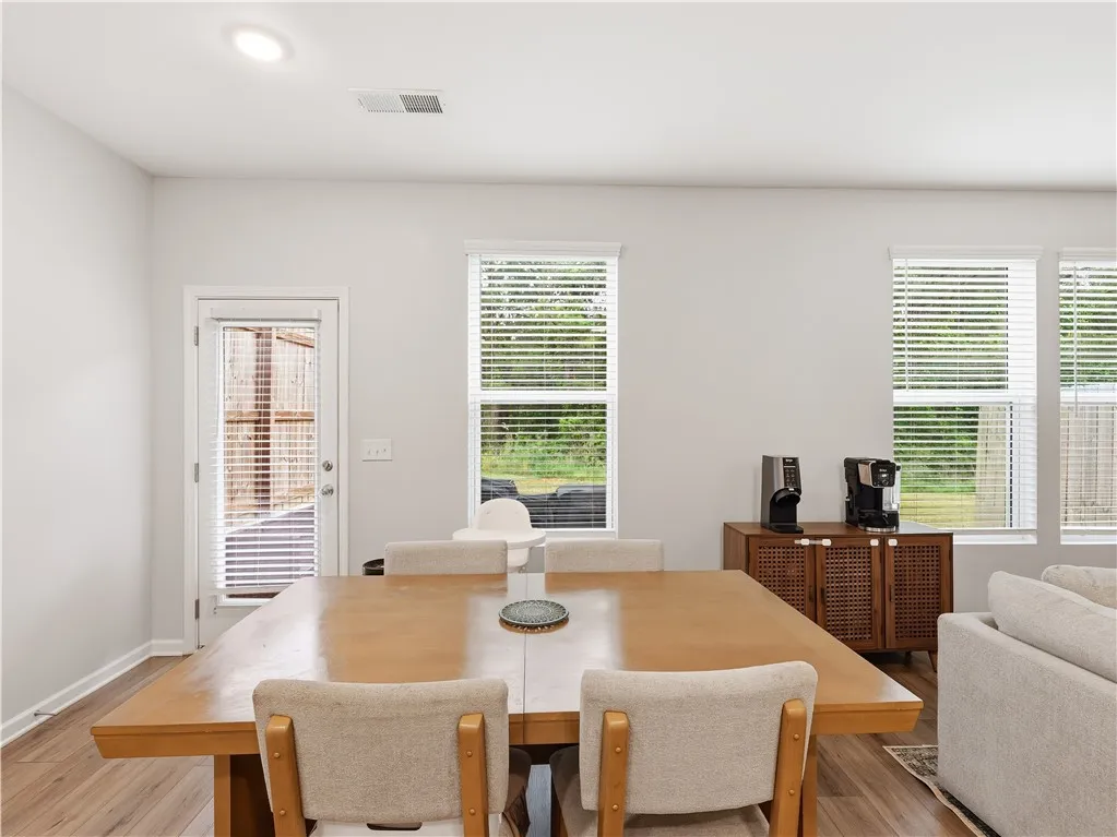 This bright dining area features an open floorplan and ample natural light, perfect for everyday​​‌​​​​‌​​‌‌​‌‌​​​‌‌​‌​‌​‌​​​‌​​ living.