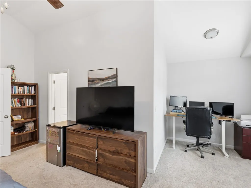 This versatile room offers both relaxation and a dedicated workspace.