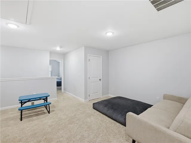 This versatile loft area offers a flexible living space, ideal for various activities.