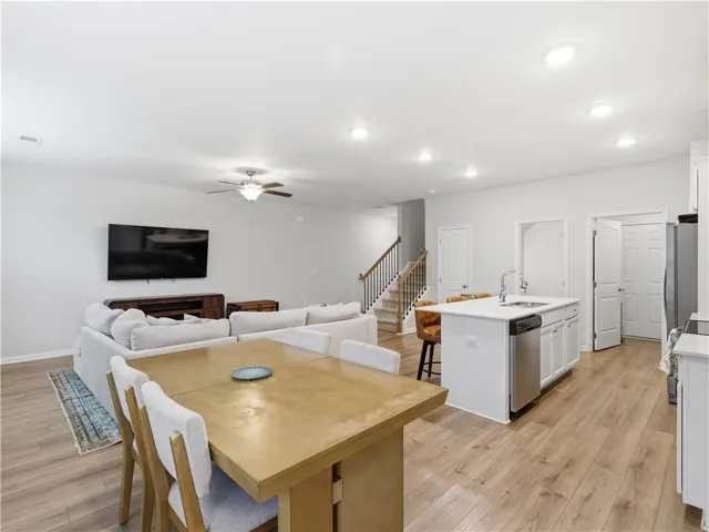 This inviting space combines living, dining, and kitchen areas for seamless daily life and entertaining.