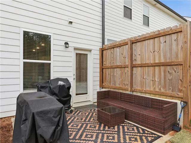This cozy patio provides an inviting outdoor space for relaxation and entertaining.