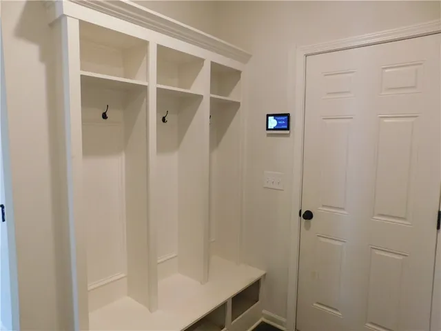 Functional built-in storage provides essential organization and a seamless entry.