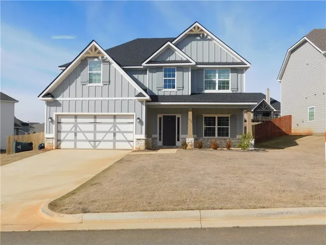 This inviting residence features a well-maintained exterior and a welcoming front entrance.