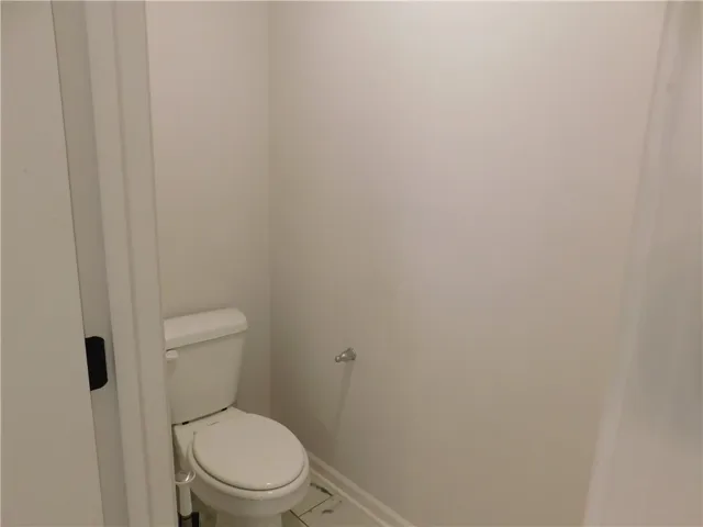 This clean and functional powder room features practical finishes for everyday convenience.