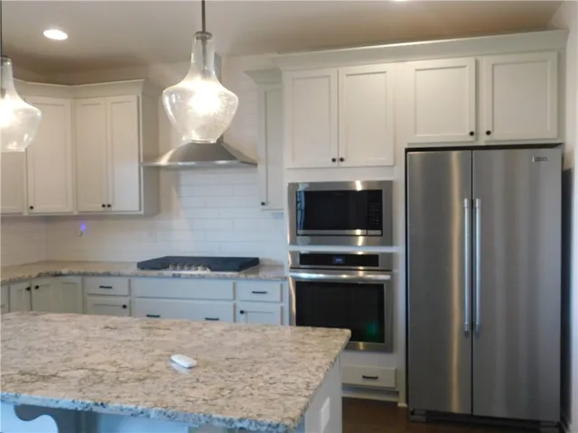 This bright kitchen features modern appliances and a spacious island for culinary creativity.