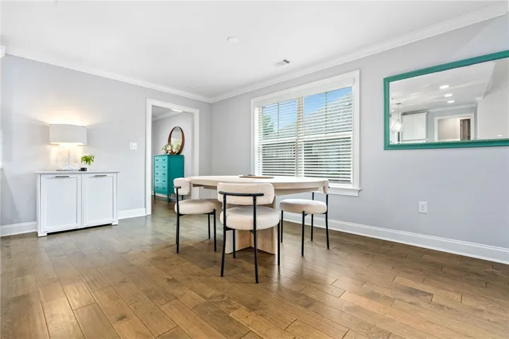 The dining space can accommodate a sizable table, plus additional furniture/decor pieces.