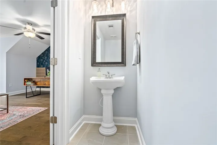 The second-floor space has the added benefit of a powder room--the ultimate convenience for this versatile room.