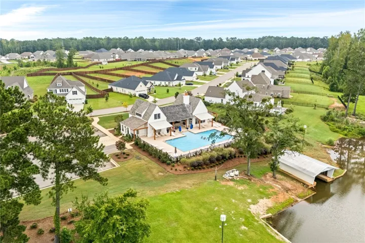 The Hidden Lakes pool and clubhouse take advantage of the lake view.