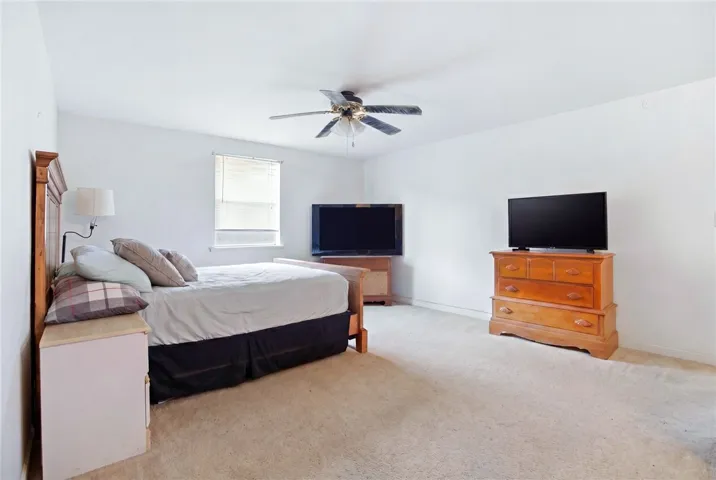 This restful bedroom offers a spacious layout for tranquil living in studio above​​‌​​​​‌​​‌‌​‌‌​​​‌‌​‌​‌​‌​​​‌​​ garage.