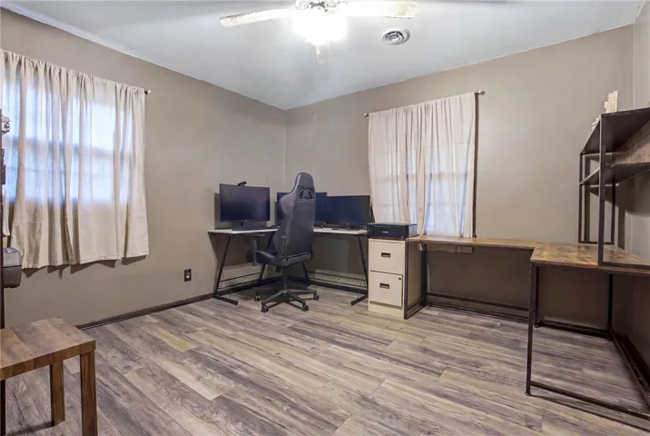 Functional workspace with ample natural light, perfect for productivity and comfortable living.